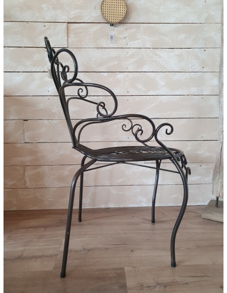 Fauteuil en forme de papillon en métal patine vieillie