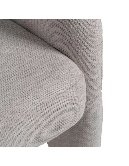 Fauteuil arrondi et design en tissu beige