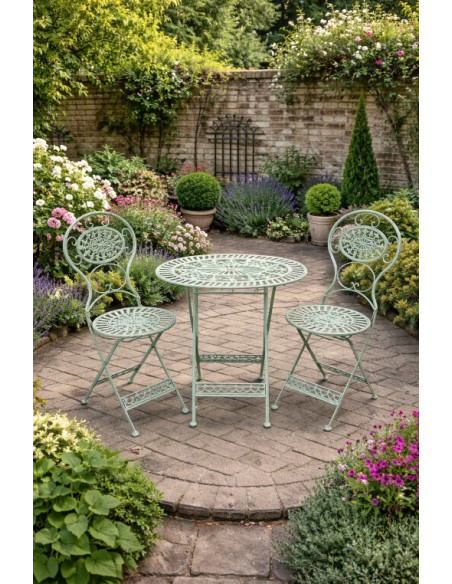 Table ovale avec deux chaises en métal effet vieilli
