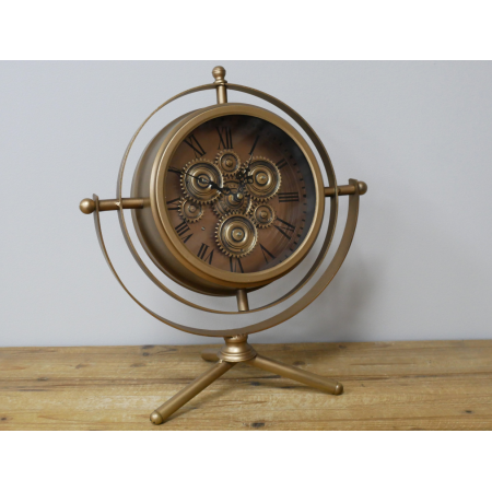 Horloge à engrenages mobiles dorée...