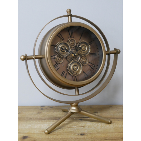 Horloge à engrenages mobiles dorée...