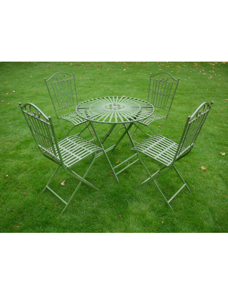 Table ronde avec quatre chaises en métal finition vert antique