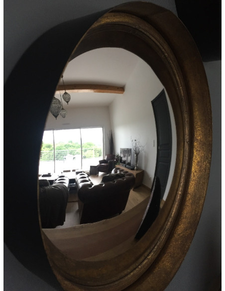 Miroir rond en métal noir intérieur cuivré